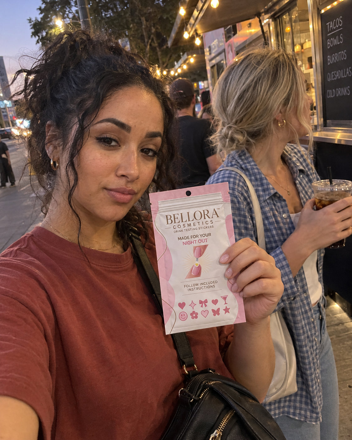 Adult woman holding Bellora at an outdoor evening market